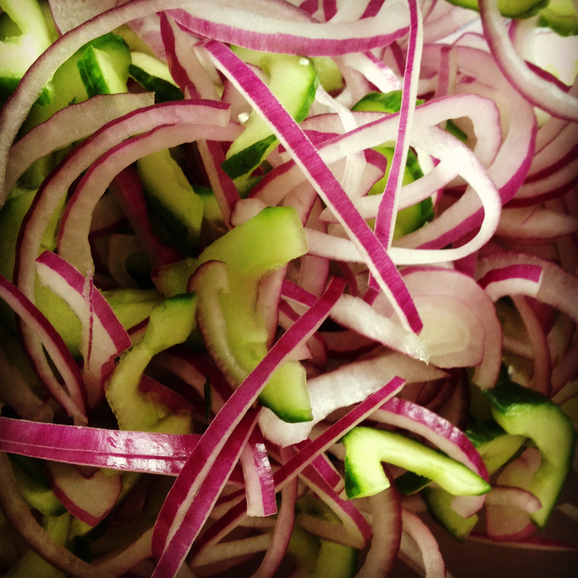 sliced cucumber and red onion